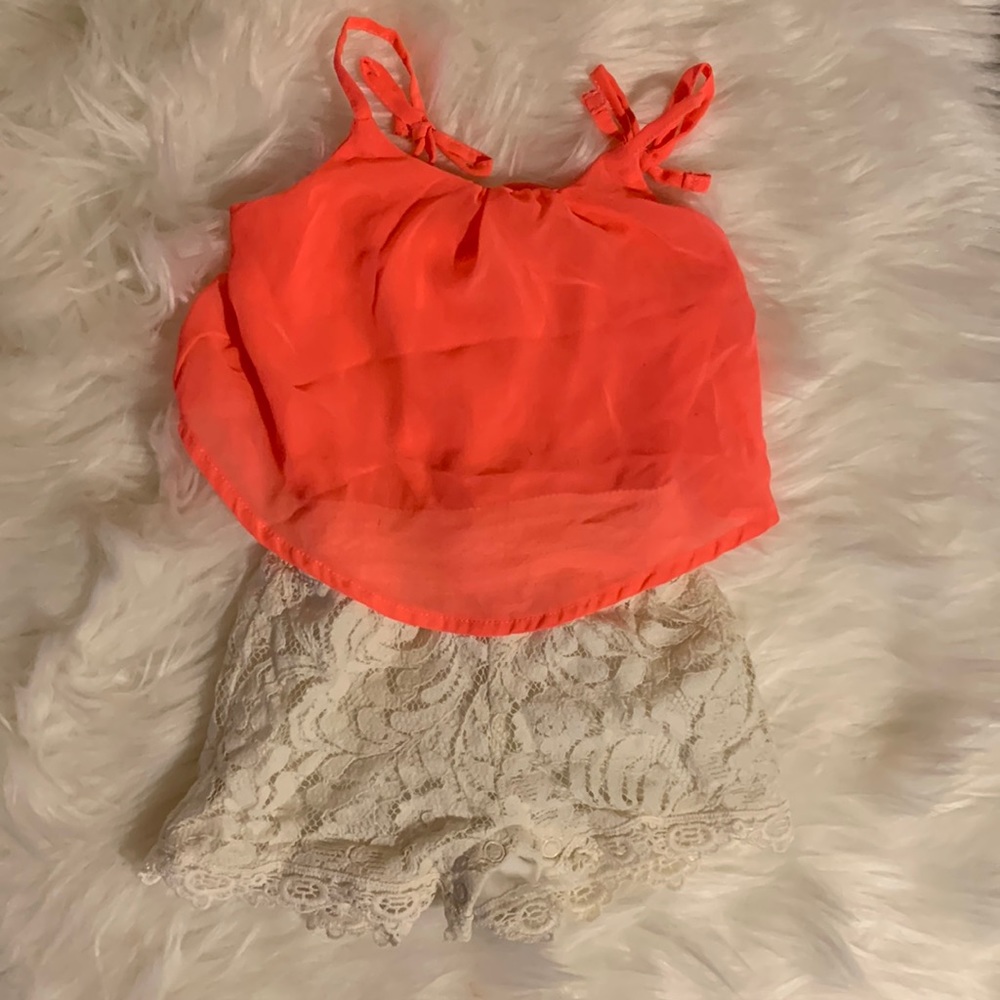 Coral, lace romper. Size/brand tag cut off. Unsure of brand. Size is 6-9M.